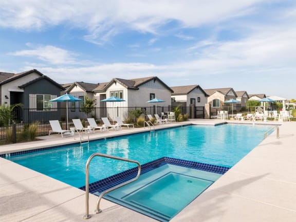 A swimming pool with a ladder in the middle of it at Onyx at Westgate Apartments, Glendale