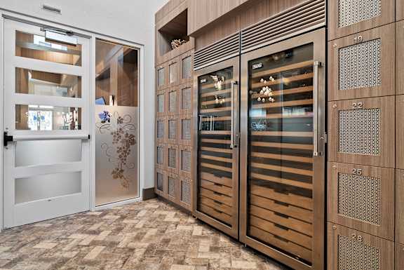 A set of wooden doors with glass panels and decorative designs. at Centre Pointe Apartments, Melbourne, 32940