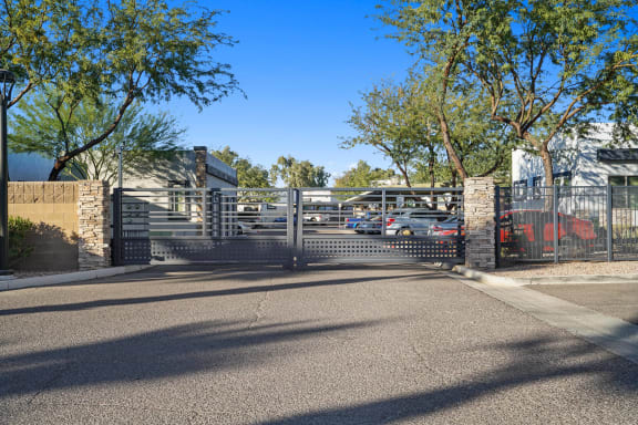 the entrance to a parking lot with a gate