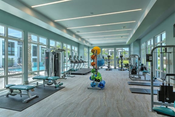 the gym in the lobby of the building at The Addison on Long Bayou Apartments, Seminole, Florida