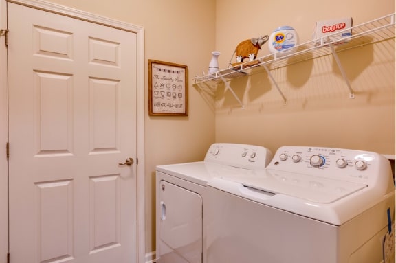 a washer and dryer in the laundry room at Magnolia Village Apartments, Florida 32207