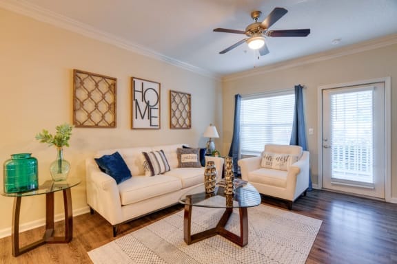 a living room with two couches and a coffee table at Magnolia Village Apartments, Jacksonville, 32207