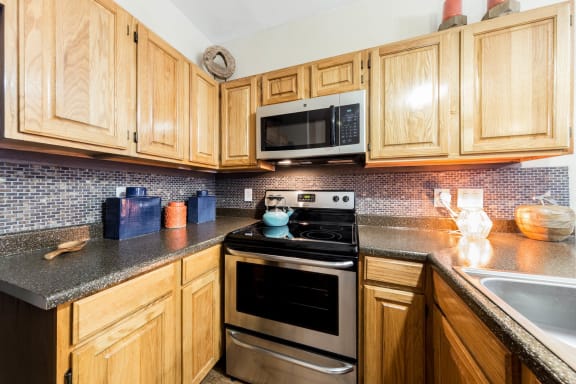 Chef-Inspired Kitchens Feature Stainless Steel Appliances at Pavilions at Northshore Apartment Homes, Portland, Texas