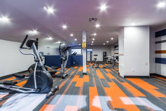 a gym with cardio machines and weights on the floor at Sundance and Sausalito Apartments, College Station, TX, 77840