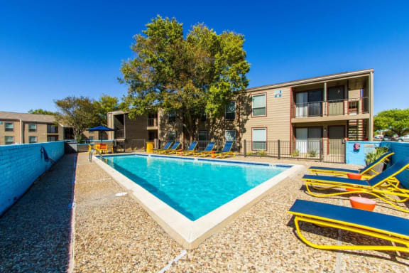 large pool and lounge chairs at Sundance and Sausalito Apartments, Texas
