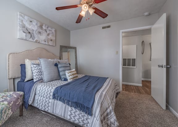 Bedroom with a bed and a ceiling fan  at Riverstone, Bryan, Texas