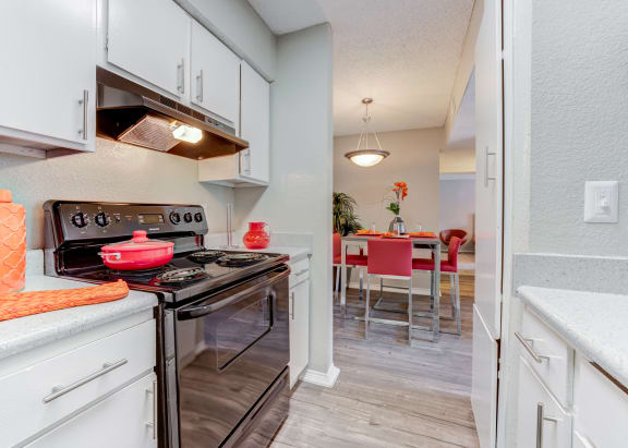 Kitchen with white cabinetry at Sausalito Apartments, College Station, 77840