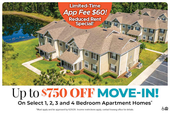 Apartment complex with a sign offering up to six weeks free rent.