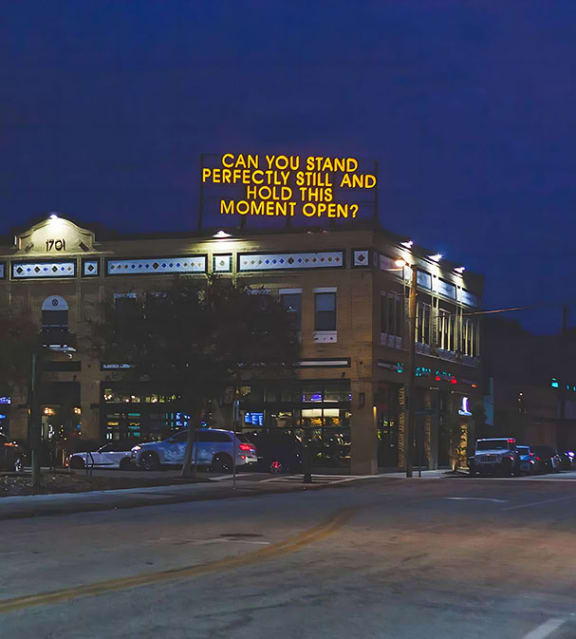 Building Sign Lit in the Evening
