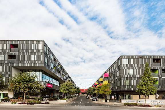 Lamar Union Apartments Overlooking Tree-Lined Walkable Plaza with Local Businesses