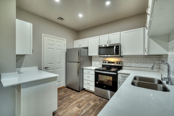 the interior kitchen with stainless steel appliances