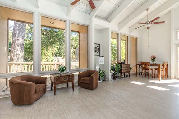 A living room with a brown chair and a brown table.
