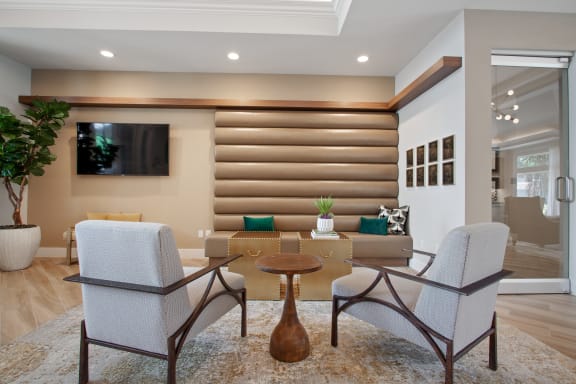 a living room with a table and chairs