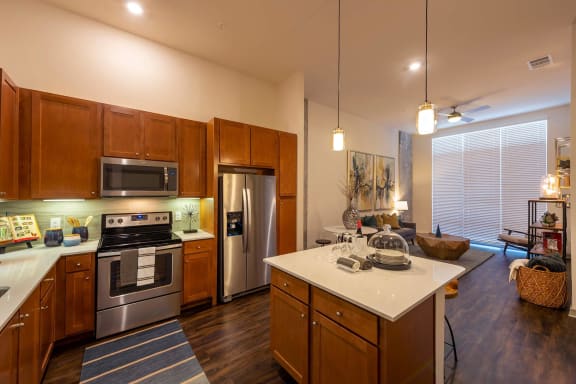 a kitchen with stainless steel appliances and a white counter top