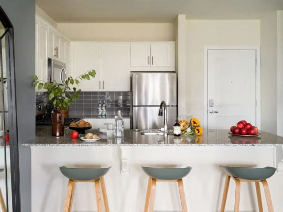 a kitchen with a counter top and a refrigerator