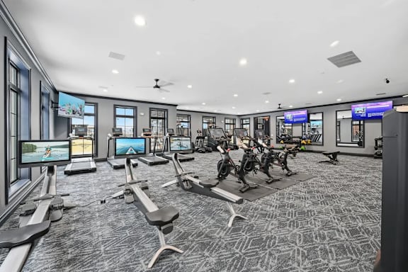 A gym with treadmills, exercise bikes, and other equipment. at Maison Apartments, Apartments, Westerville, OH