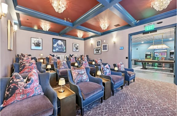 A room with a blue ceiling and chairs with pillows. at Maison Apartments, Westerville, Ohio
