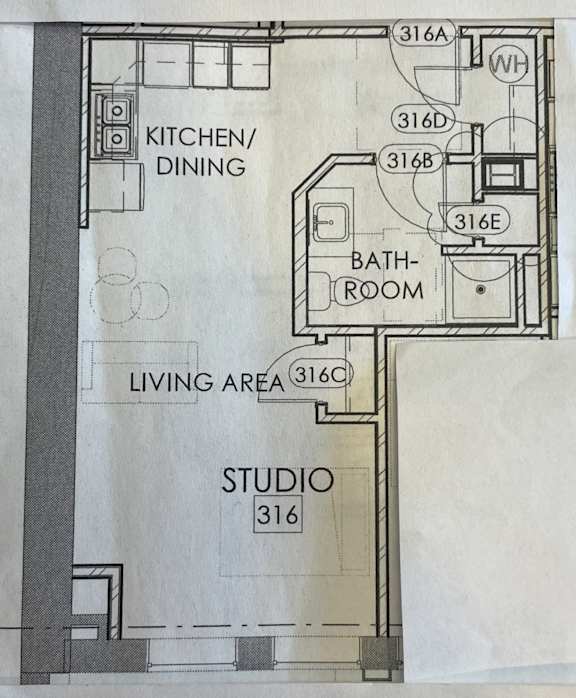 a floor plan of a small house with a living area and a bathroom