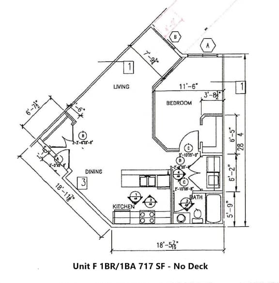 A drawing of a floor plan for a living space with a kitchen and bathroom.