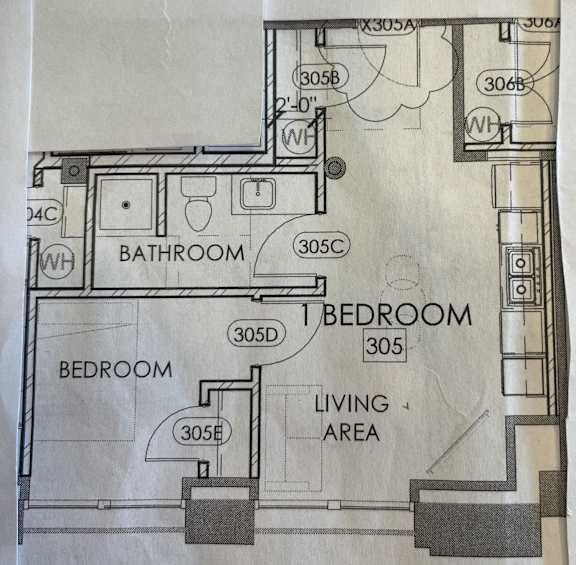 a drawing of a floor plan of a bathroom and a bedroom