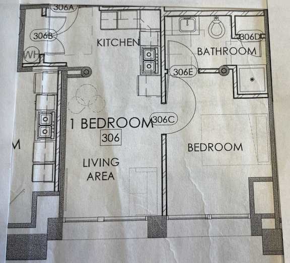 a drawing of a floor plan of a bathroom and living area