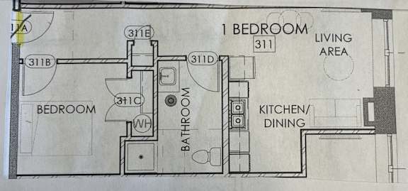 a drawing of a floor plan of a kitchen and living area