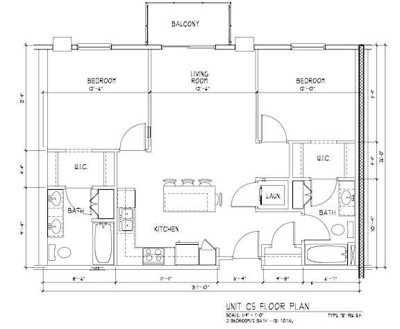 A floor plan of a unit with a living room, two bedrooms, a kitchen, a bathroom, and a laundry area.