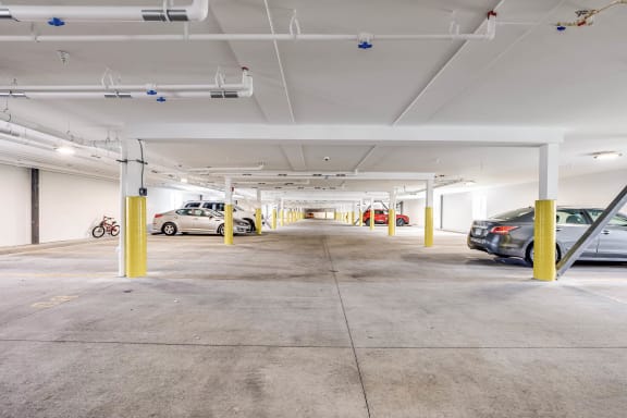 a parking garage with cars parked in it