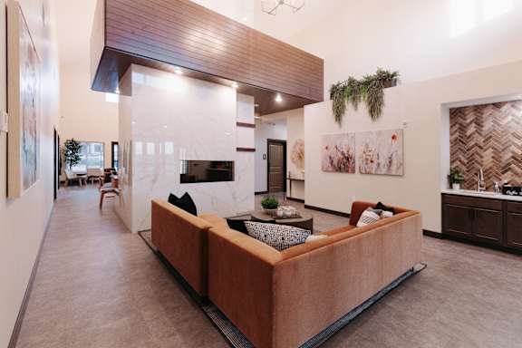 a living room with a couch and a fireplace