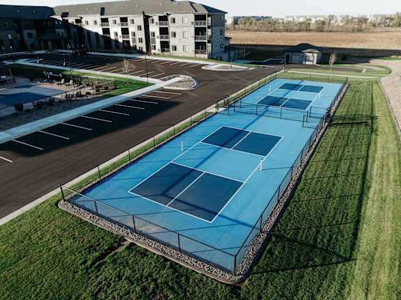 an aerial view of the tennis court at the resort