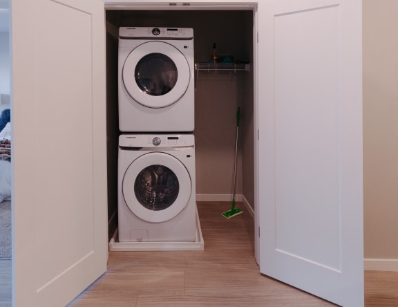 a washing machine and dryer in a laundry room