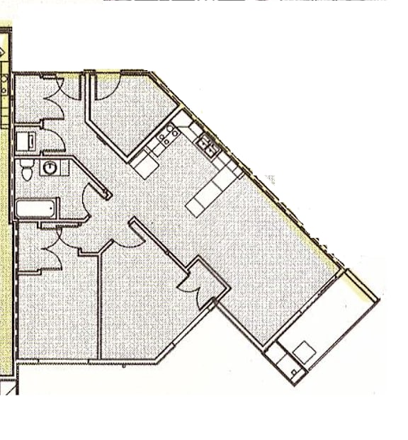 A floor plan of a building with a kitchen, living room, and bathroom.