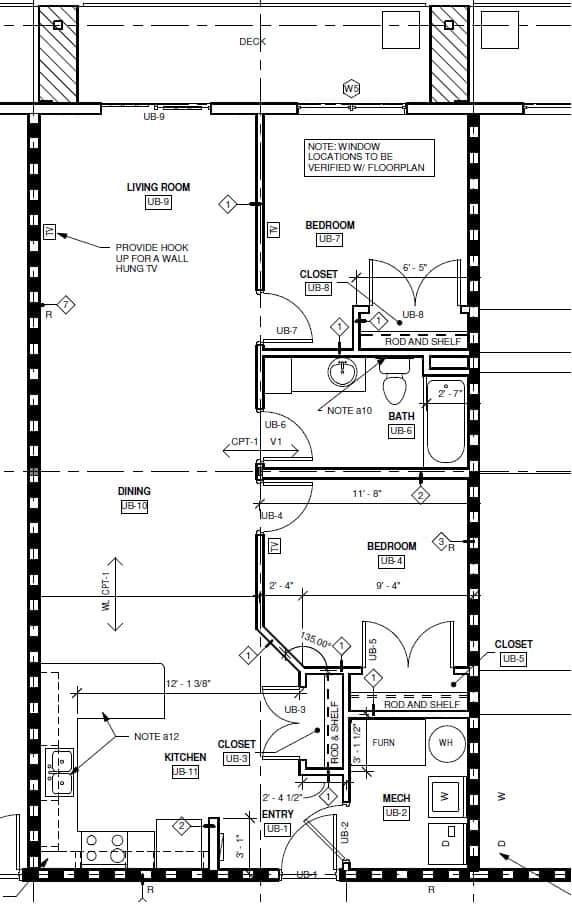 A drawing of a floor plan for a house with a living room, dining room, kitchen, and bathroom.