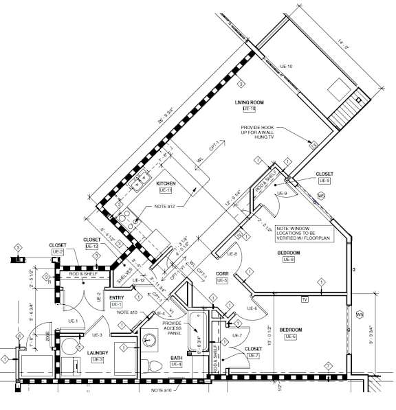 A detailed architectural drawing of a house plan with labeled rooms and measurements.