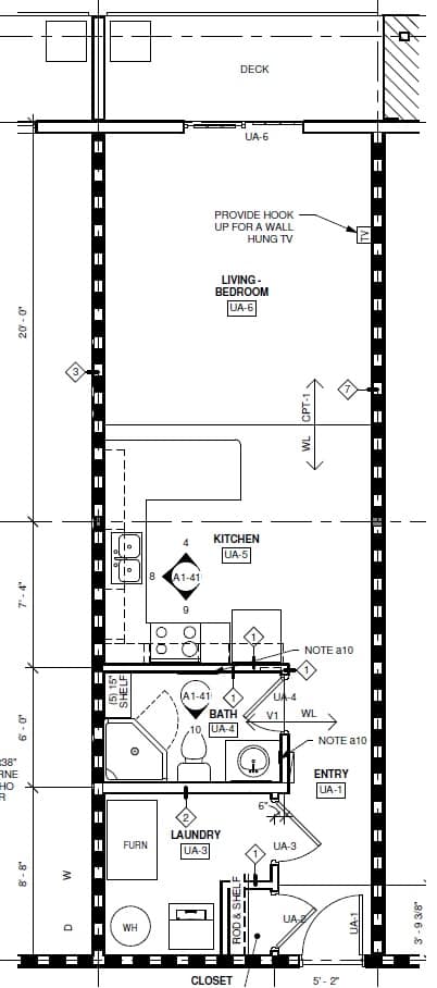 A floor plan of a small apartment with a living room, kitchen, bathroom, and laundry area.