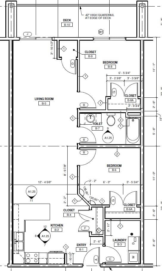 A floor plan of a house with a living room, kitchen, and two bathrooms.