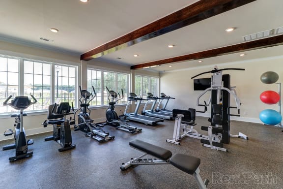 Gym with cardio equipment and windows with a lake view  at The Meadows, Bloomingdale, GA, 31302