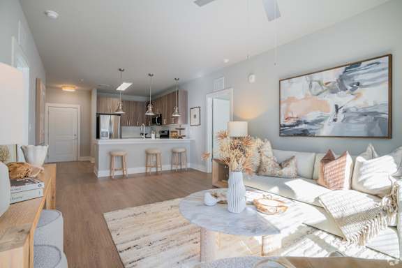 Living Room With Kitchen Area at The Delaney at East Park Apartments, Kennesaw, 30144