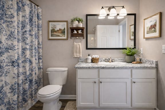 Bathroom with sink at Club Villas Apartments, Kathleen, GA