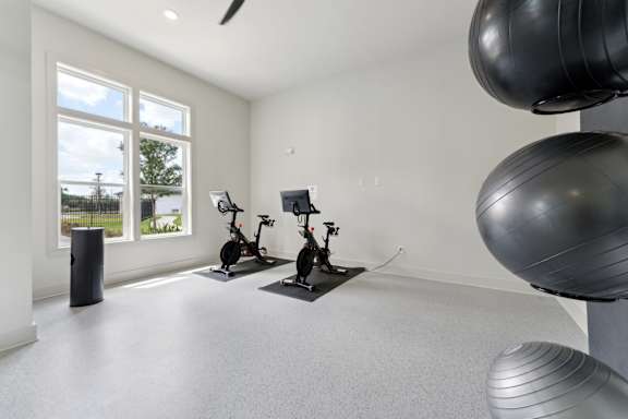 A room with exercise equipment and a large exercise ball at The Hendry Apartments, Fort Myers, FL, 33905