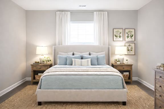 Bedroom with a large bed and two lamps at Club Villas Apartments, Kathleen, Georgia
