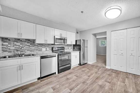 A Kitchen With Wooden Floors at Avondale Place Apartments, Georgia