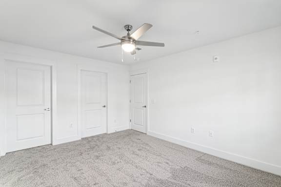 A room with a ceiling fan and carpeted floor at The Parker North Augusta, North Augusta, SC, 29841