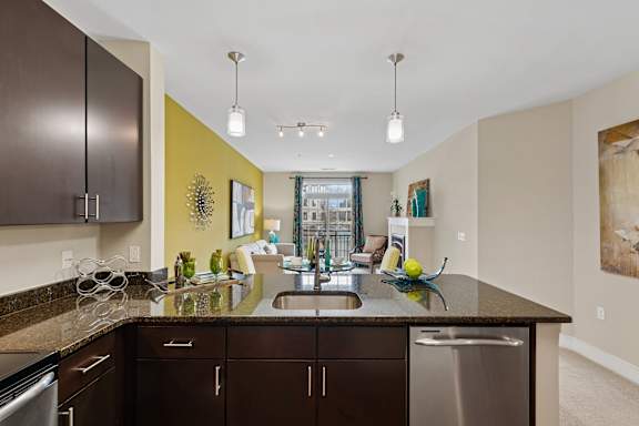 Kitchen with brown cabinets and countertop at Hidden Creek, Gaithersburg