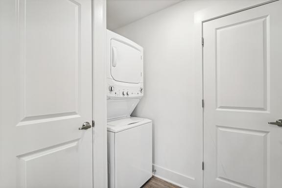 A white laundry room with a washer and dryer at The Parker North Augusta, North Augusta, SC, 29841