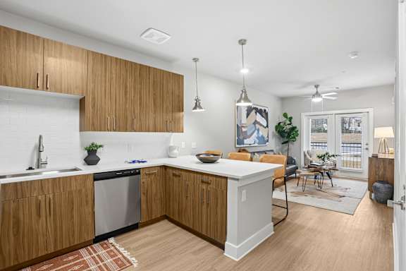 A kitchen with wooden cabinets and a white countertop.