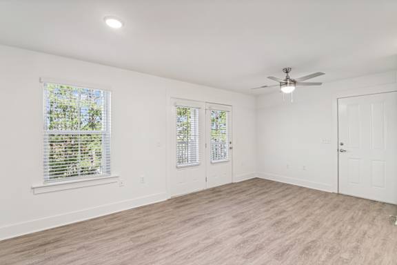 A room with a ceiling fan and two windows at The Parker North Augusta, North Augusta, SC, 29841