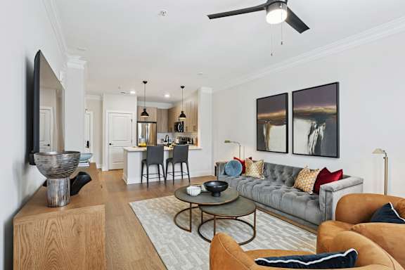 A living room with a grey couch and a coffee table at Union Eleven Apartments, Atlanta, 30324