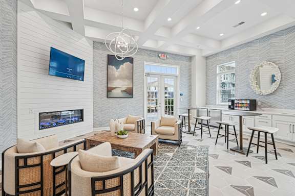 A modern living room with a fireplace and a flat screen TV.