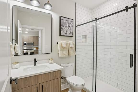 bathroom with a white sink and toilet. at Union Eleven Apartments, Atlanta